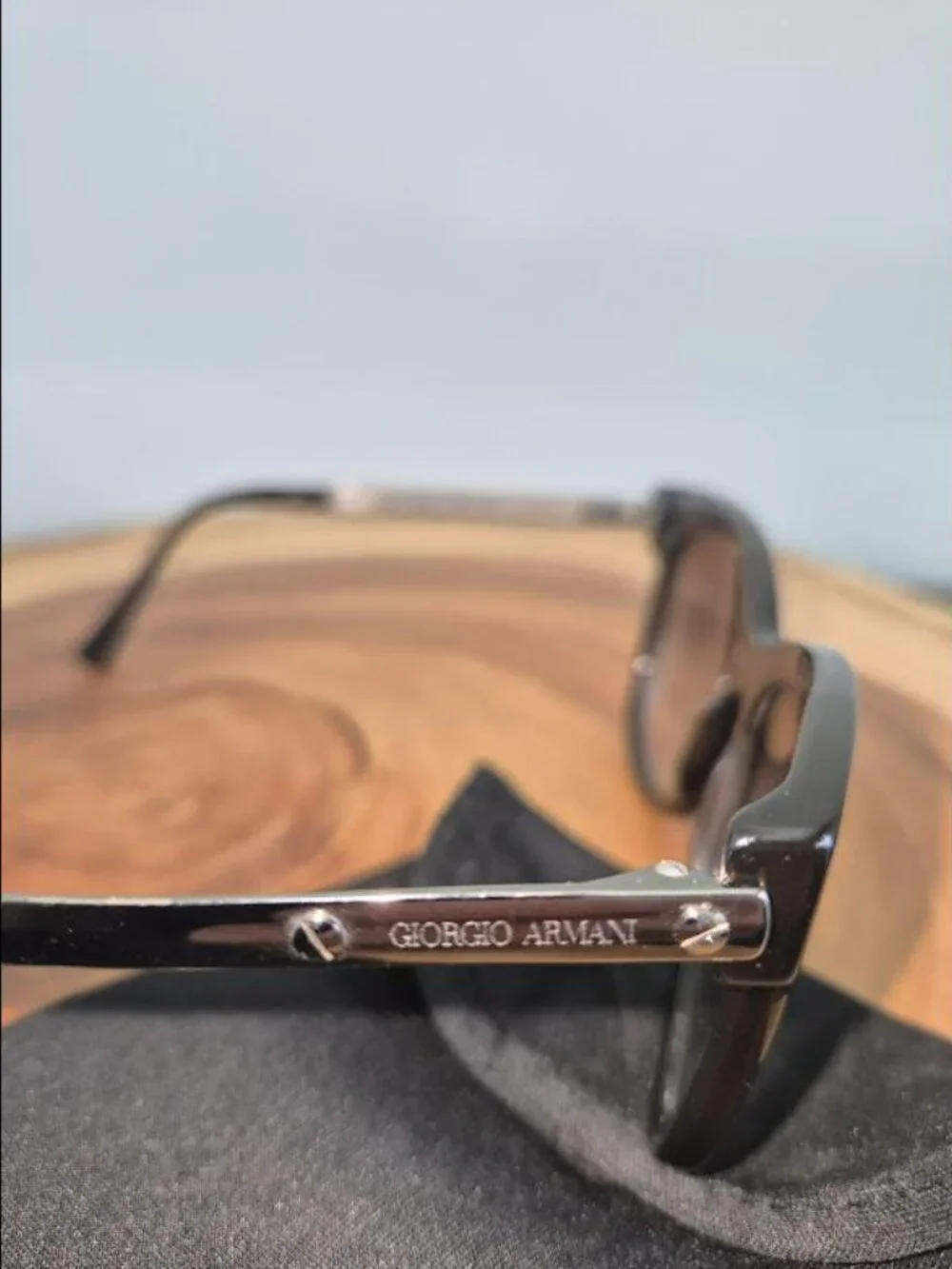 Giorgio Armani with A/X sunglass bag